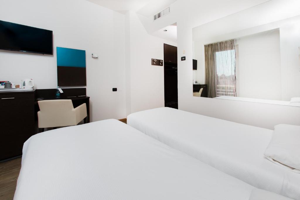 Postel nebo postele na pokoji v ubytování Hotel Bonotto