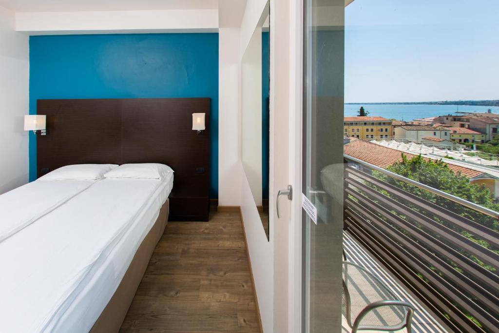 Postel nebo postele na pokoji v ubytování Hotel Bonotto
