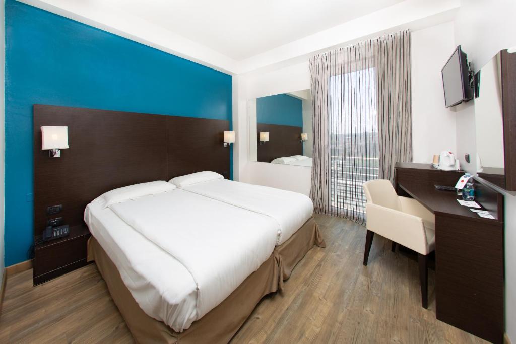 Postel nebo postele na pokoji v ubytování Hotel Bonotto