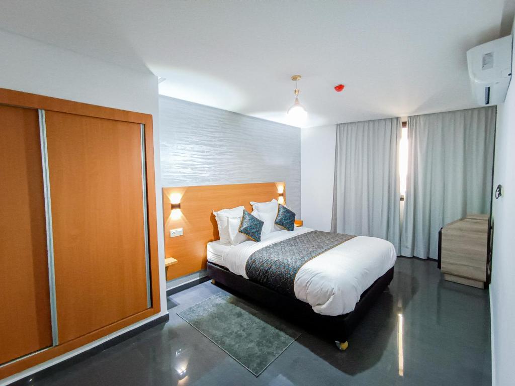 Krevet ili kreveti u jedinici u okviru objekta Hotel SunSet Beni Mellal