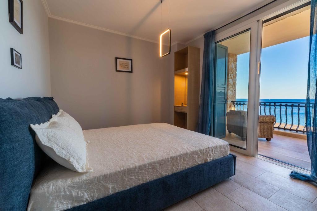 Кровать или кровати в номере Gold Sun Villas