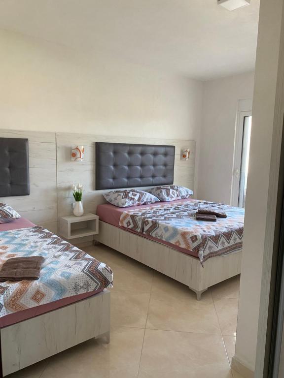 Postel nebo postele na pokoji v ubytování Apartments Catalic