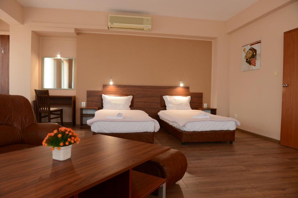 Postel nebo postele na pokoji v ubytování Family Hotel Gotse Delchev