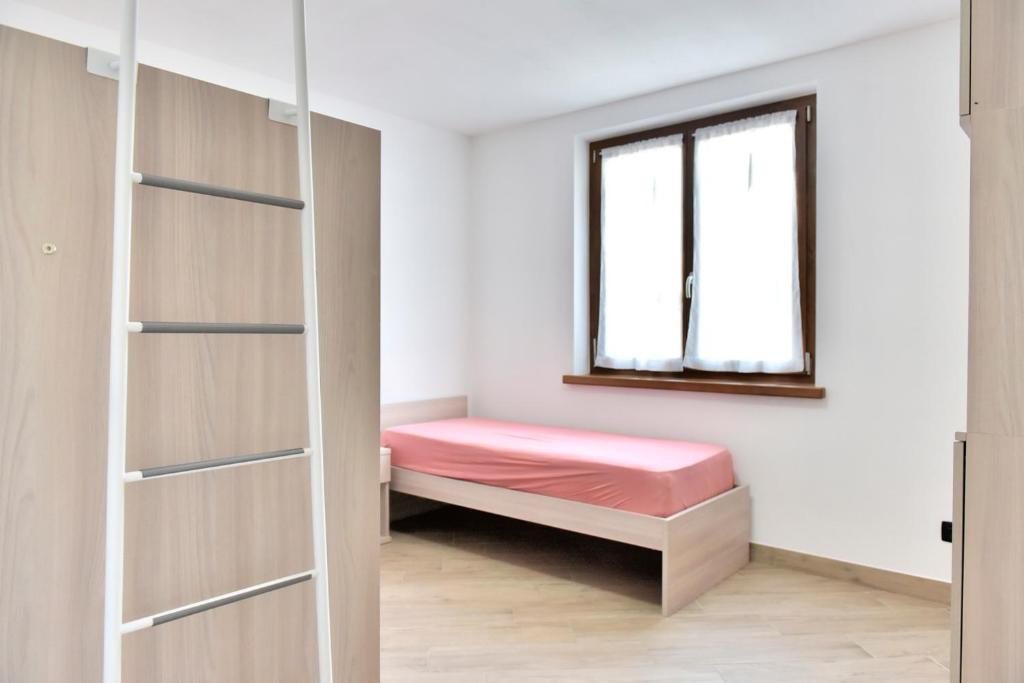 Łóżko lub łóżka w pokoju w obiekcie La Pieve Apartments