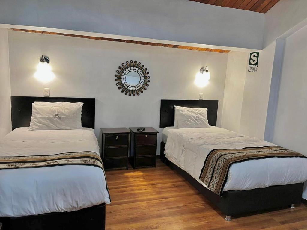 Postel nebo postele na pokoji v ubytování Hostal Casona Arrambide