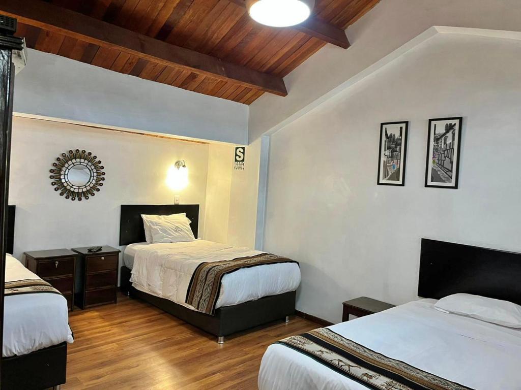 Postel nebo postele na pokoji v ubytování Hostal Casona Arrambide