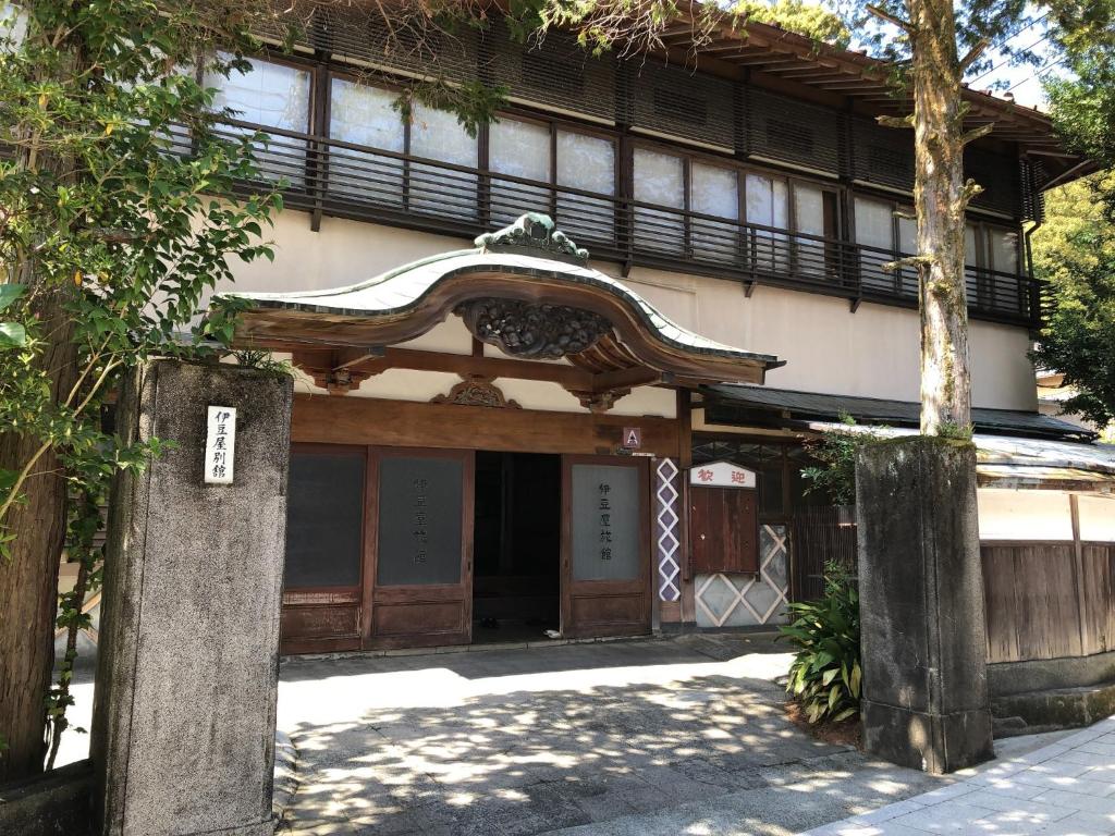 an entrance to a building with a sign on it at Izuya Ryokan - Vacation STAY 87162v in Miyakami