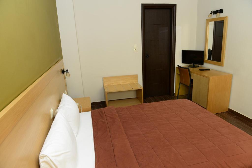 Postel nebo postele na pokoji v ubytování Ionion Hotel