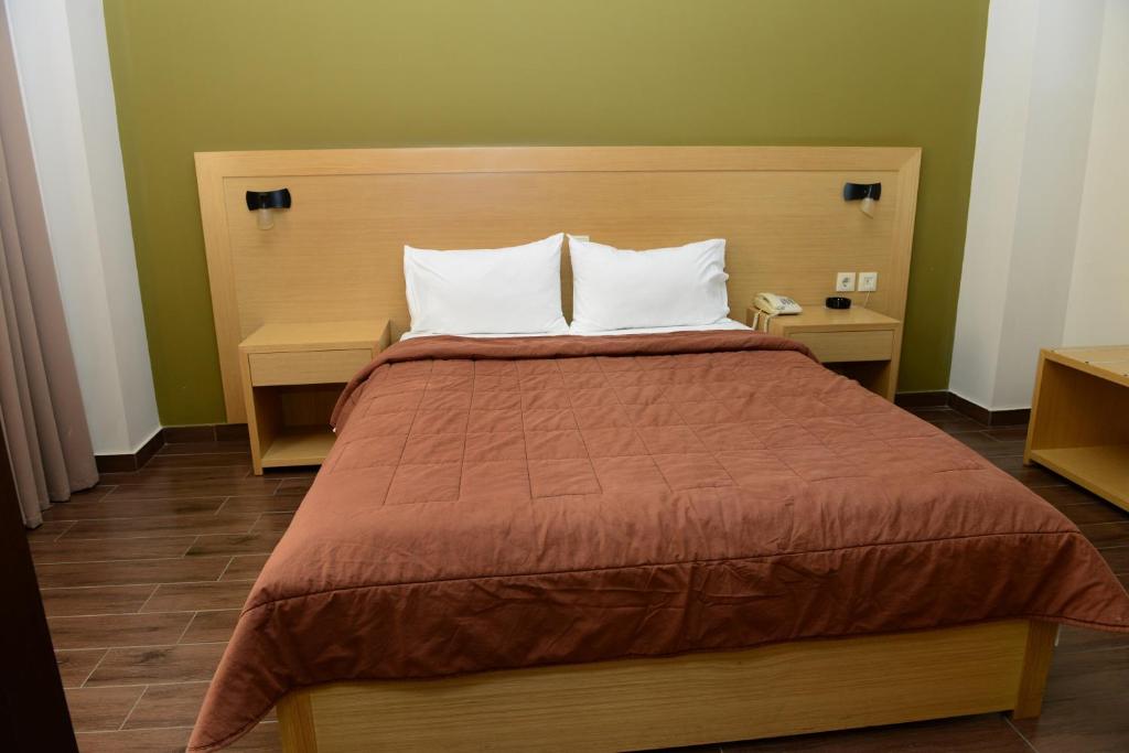 Postel nebo postele na pokoji v ubytování Ionion Hotel