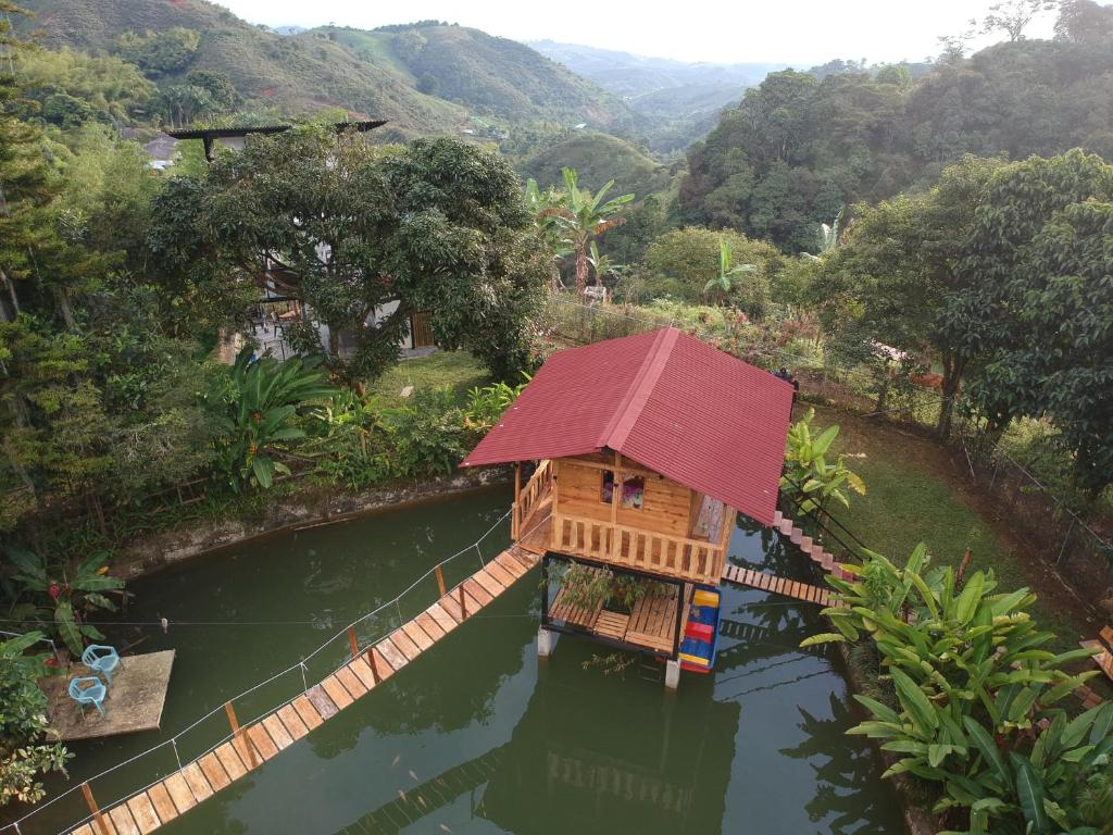 an aerial view of a house in the water at Aventura Treehouse Glamping in Palmira