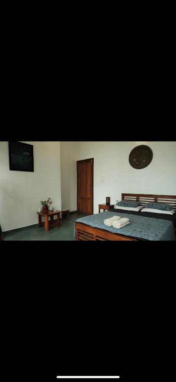 Katil atau katil-katil dalam bilik di Neela Waters - Beach Home