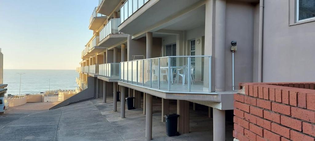 a balcony with a table on the side of a building at Dolphin View 308 in Margate