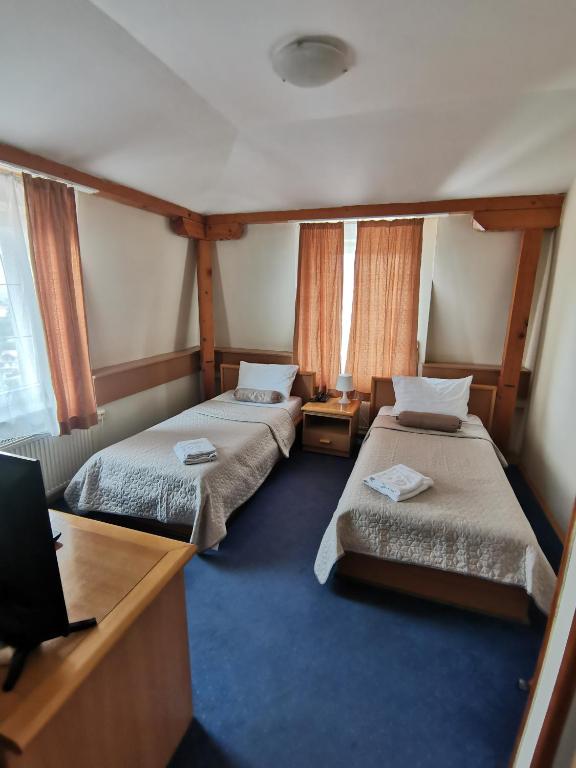 Voodi või voodid majutusasutuse Garni Hotel Panorama Lux toas