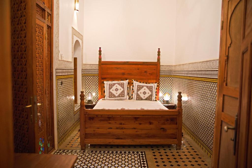 Postel nebo postele na pokoji v ubytování Riad Ouliya