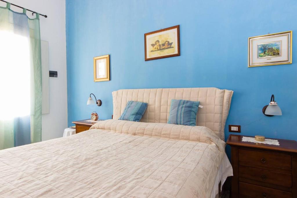 Postel nebo postele na pokoji v ubytování L'Isola Di Ortigia