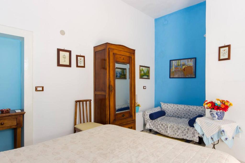 Postel nebo postele na pokoji v ubytování L'Isola Di Ortigia