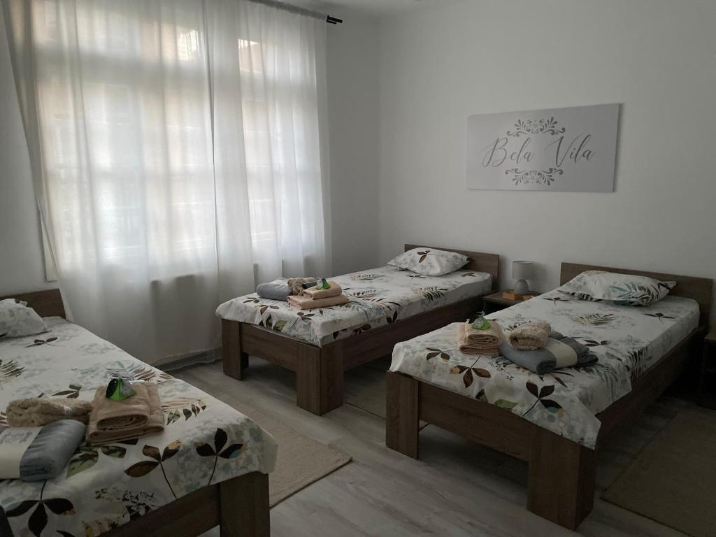 Postel nebo postele na pokoji v ubytování BELA VILA