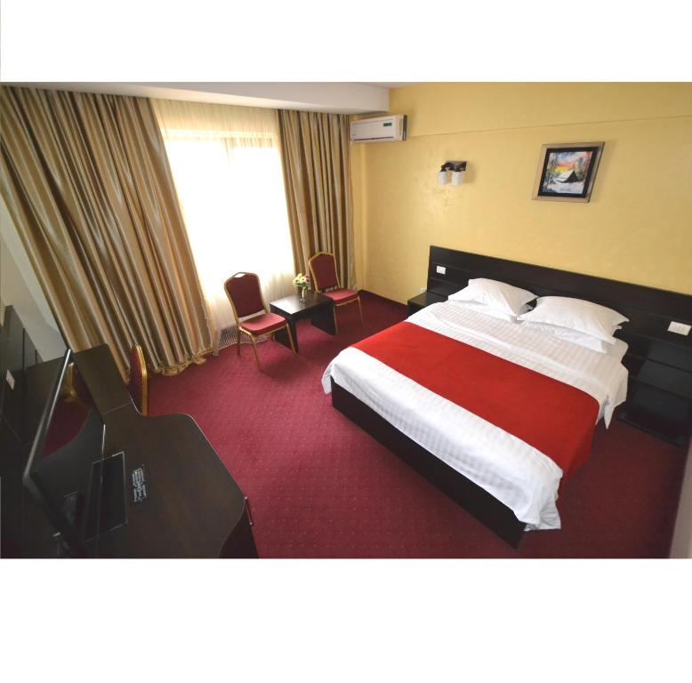 Postel nebo postele na pokoji v ubytování Hotel Ancor