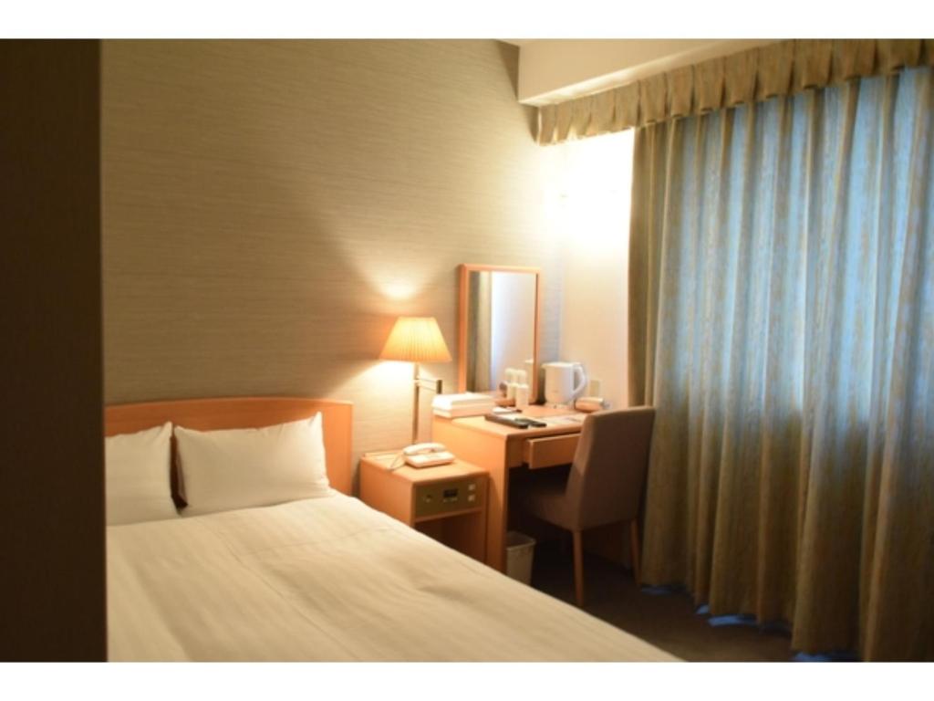Bright Park Hotel - Vacation STAY 67808v tesisinde bir odada yatak veya yataklar