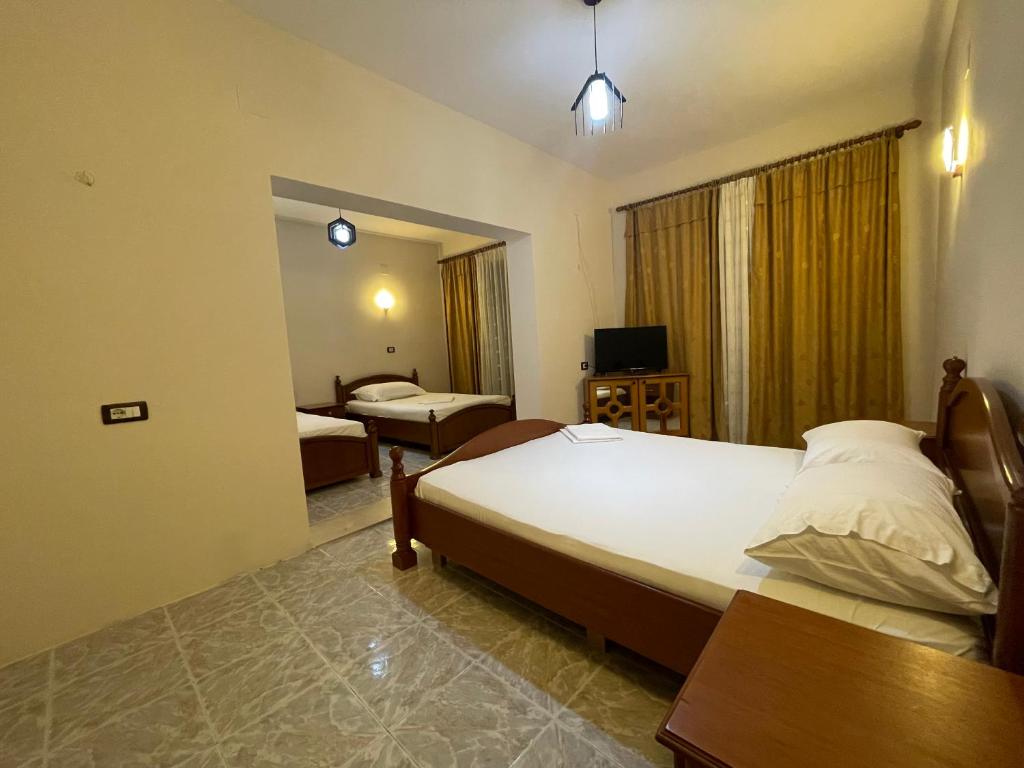 Postel nebo postele na pokoji v ubytování Hotel Belvedere