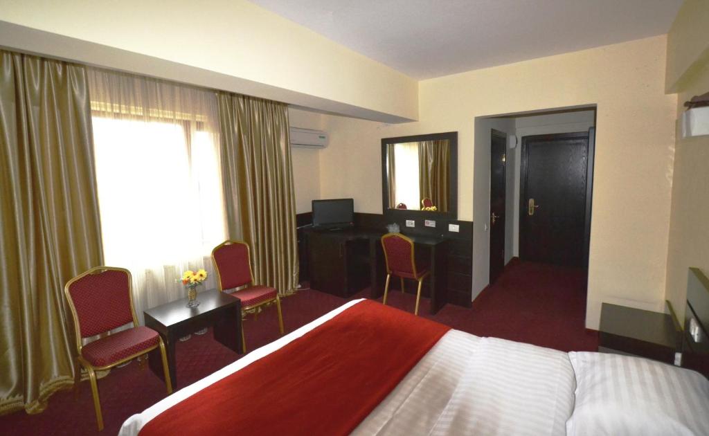 Postel nebo postele na pokoji v ubytování Hotel Ancor