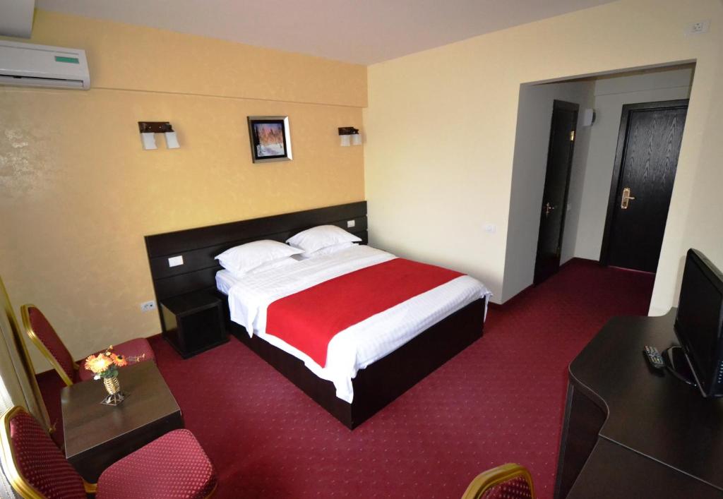 Postel nebo postele na pokoji v ubytování Hotel Ancor