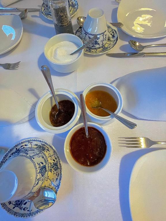 a table with two bowls of soup and spoons at Whitestrand B&B in Malin Head