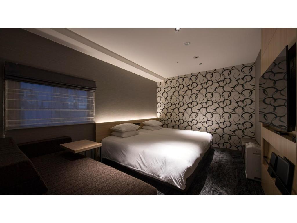 Postel nebo postele na pokoji v ubytování Tmark City Hotel Kanazawa - Vacation STAY 90393v