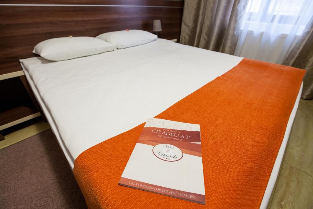 Postel nebo postele na pokoji v ubytování Hotel Citadella