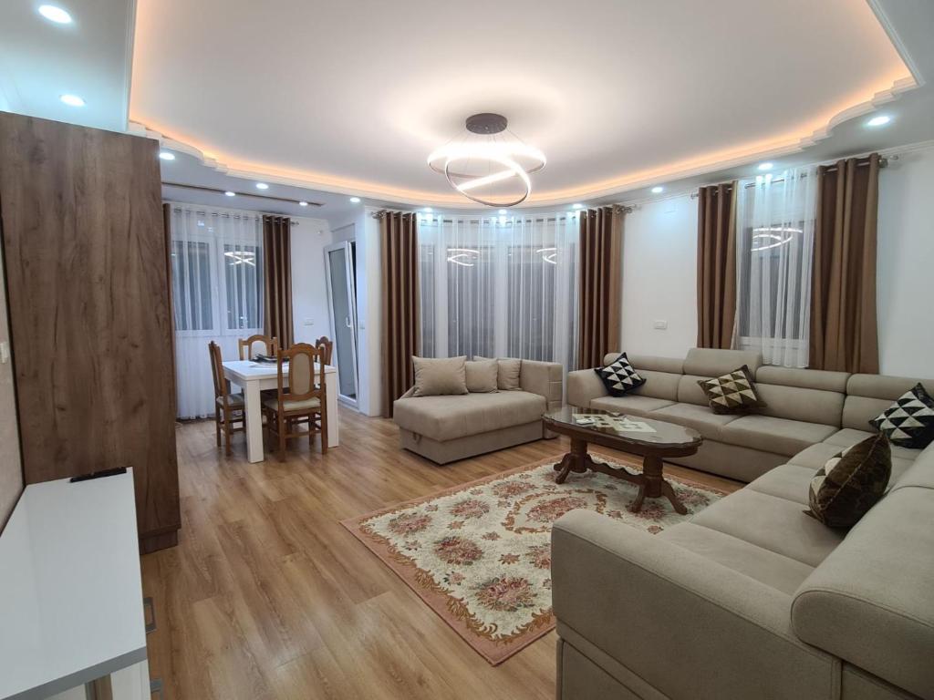 a living room with a couch and a table at Lida apartments in Ulcinj