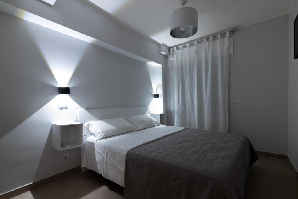 Postel nebo postele na pokoji v ubytování Citrarium B&B - Apartaments