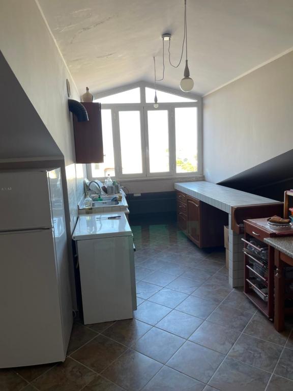 a kitchen with a sink and a counter top at Casa vacanze open space in Carrao