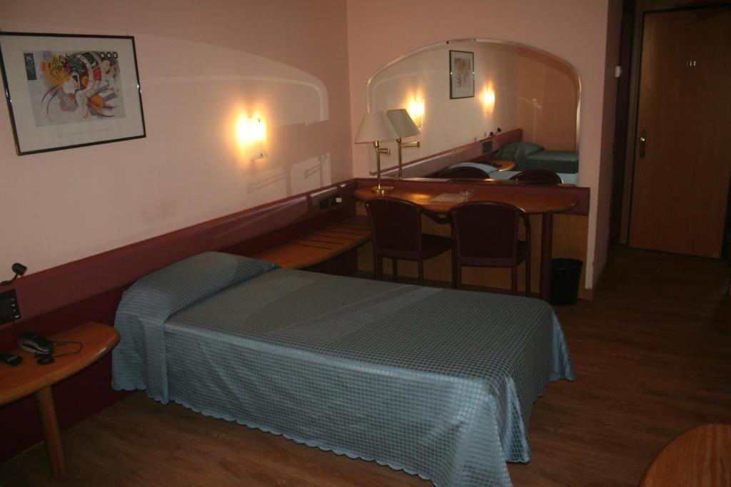 Postel nebo postele na pokoji v ubytování Albert Hotel