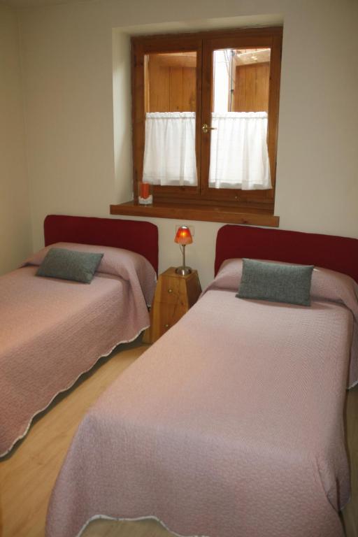 Posteľ alebo postele v izbe v ubytovaní Apartamentos Valle de Aran