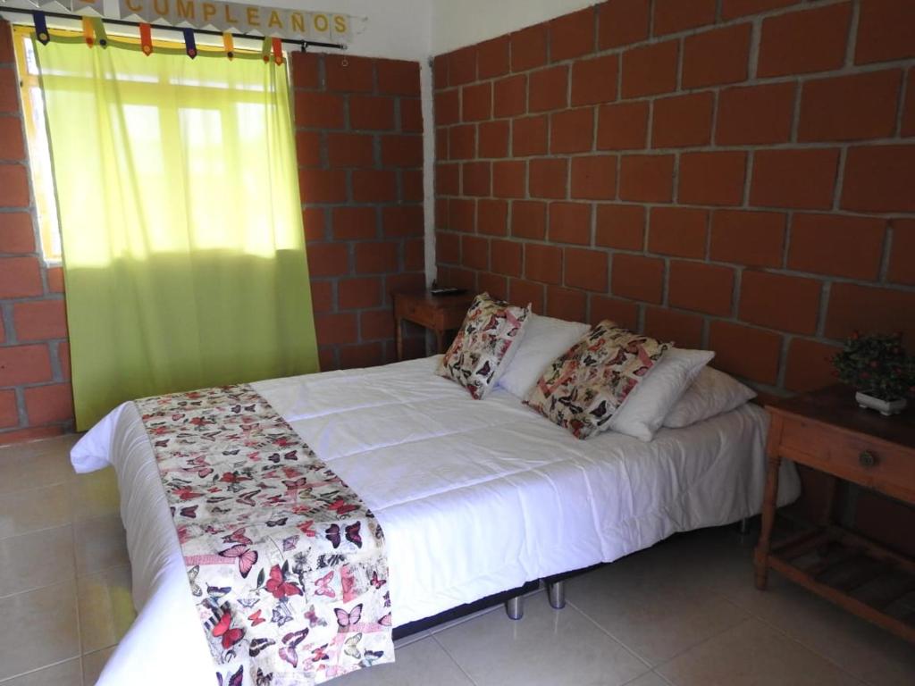 Postel nebo postele na pokoji v ubytování LA RIVERA HOSTERIA CAMPESTRE
