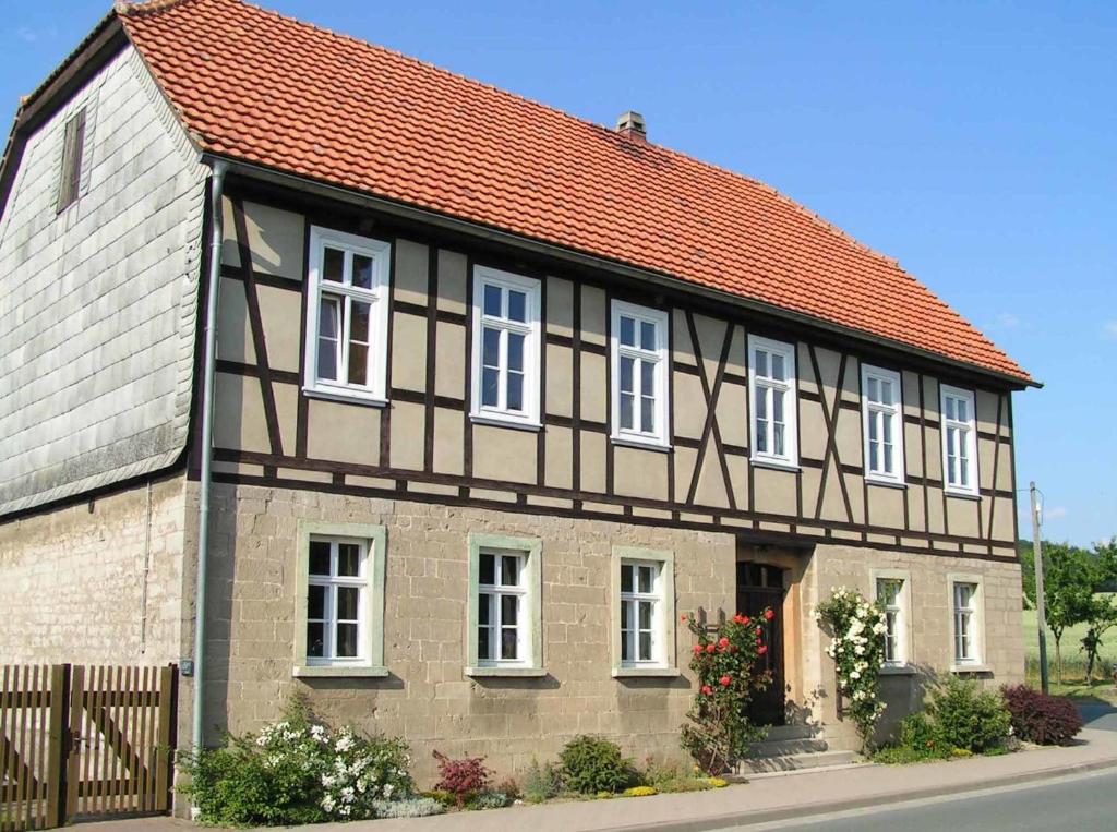 an old house with a red roof at FeWo Gutendorf in Bad Berka