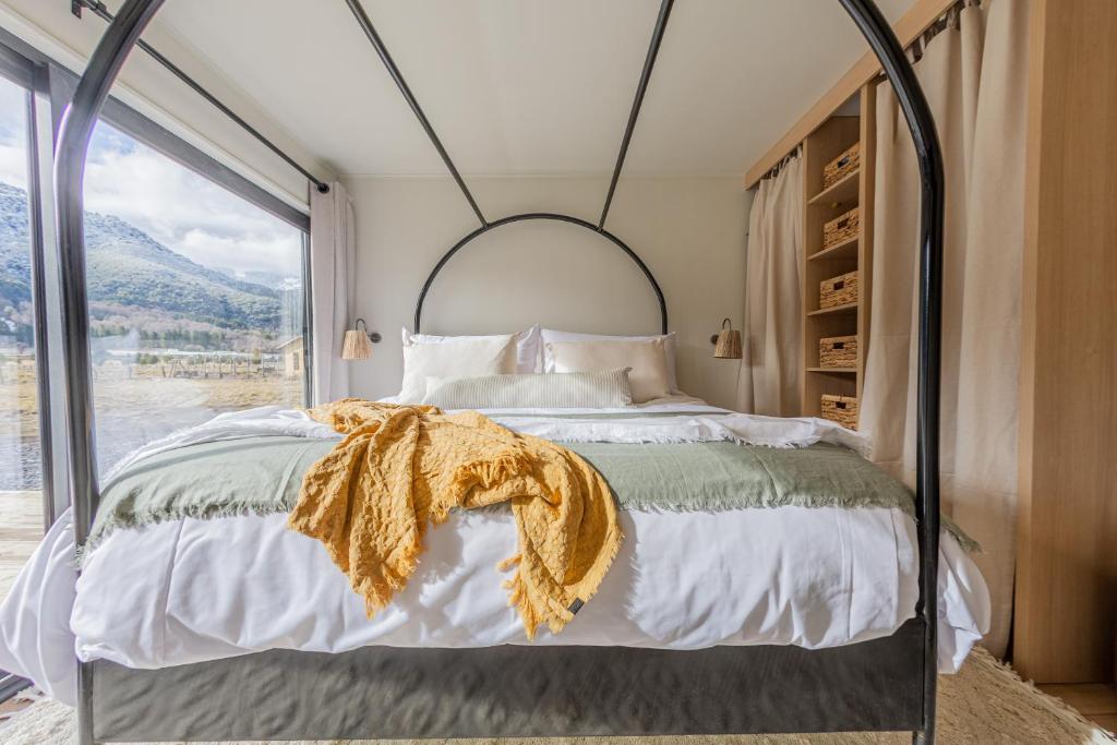Кровать или кровати в номере Lodge Ojos de Nieve