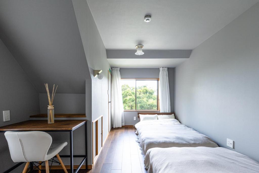Postel nebo postele na pokoji v ubytování Resort stay Bowen ~伊豆高原~
