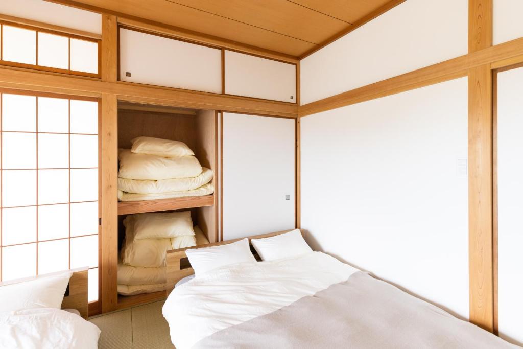 Postel nebo postele na pokoji v ubytování Resort stay Bowen ~伊豆高原~
