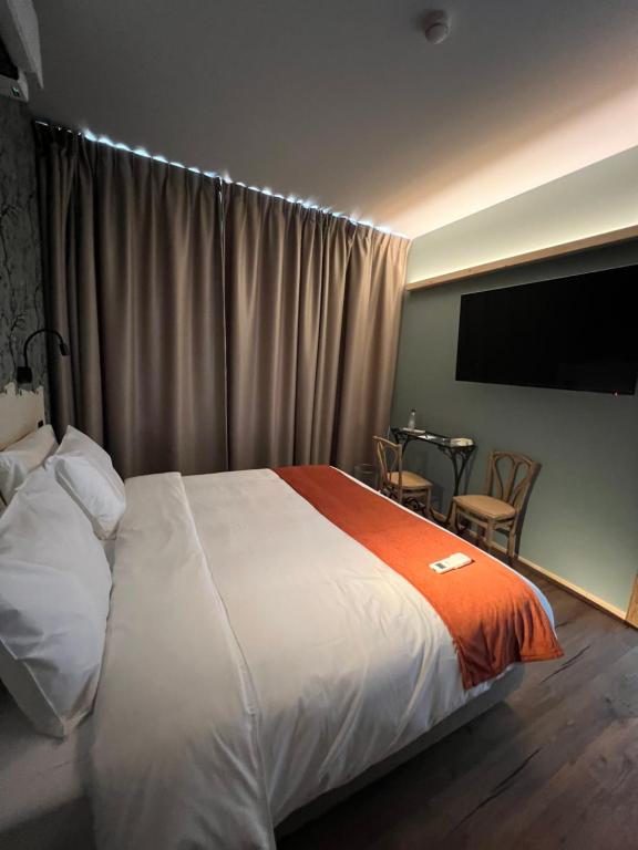 Postel nebo postele na pokoji v ubytování Hôtel Maison Demelenne