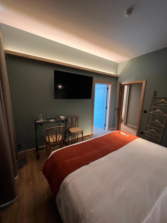 Postel nebo postele na pokoji v ubytování Hôtel Maison Demelenne