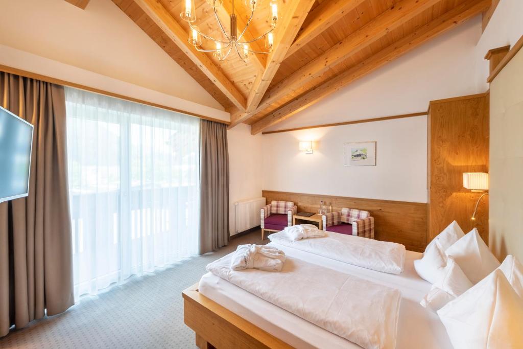 Postel nebo postele na pokoji v ubytování Hotel Rosskopf
