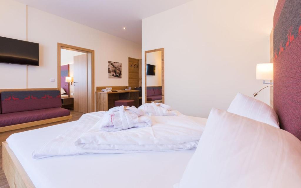 Postel nebo postele na pokoji v ubytování Panoramahotel Gürtl