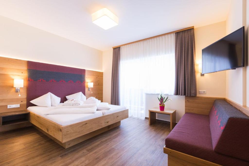Postel nebo postele na pokoji v ubytování Panoramahotel Gürtl
