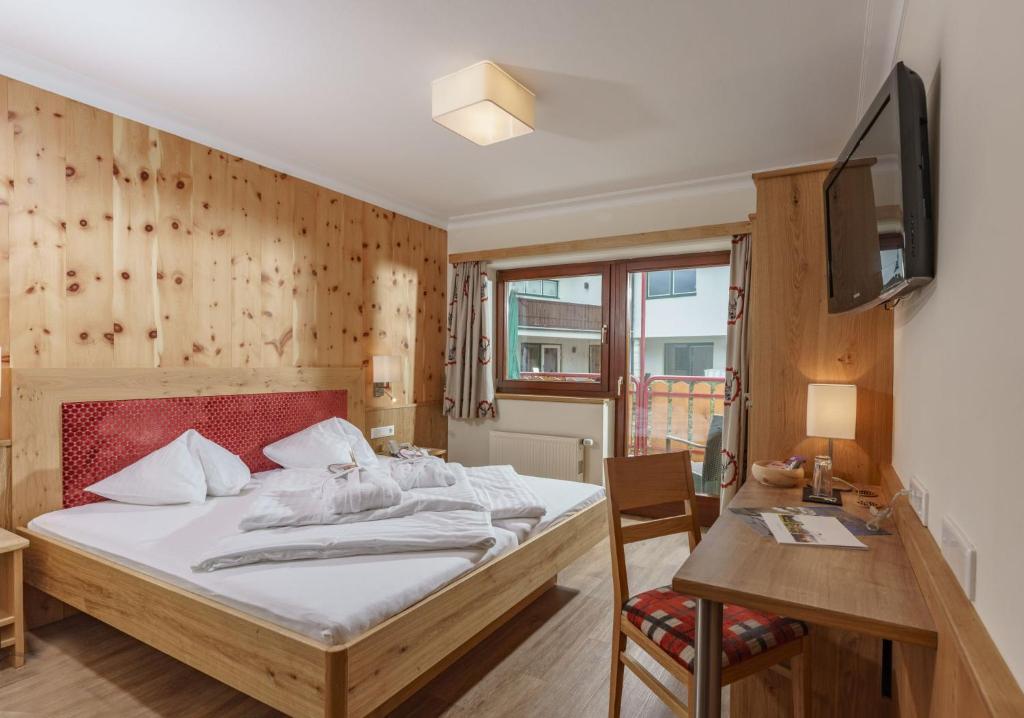 Postel nebo postele na pokoji v ubytování Panoramahotel Gürtl