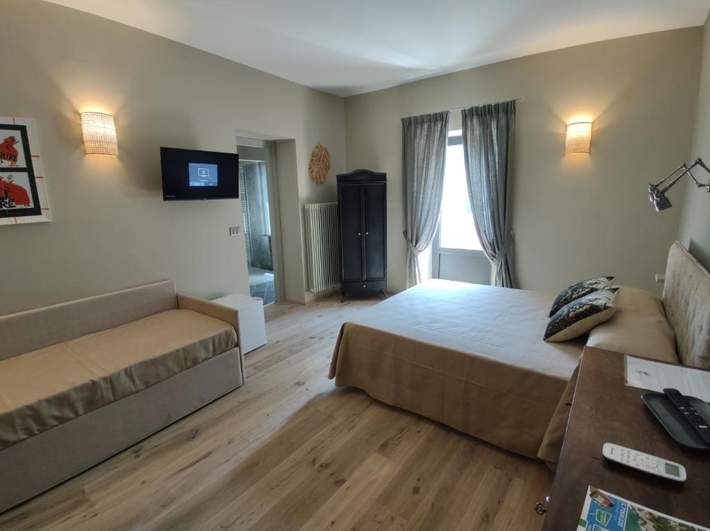 TV a/nebo společenská místnost v ubytování Agriturismo Peq Agri-Resort Tovo