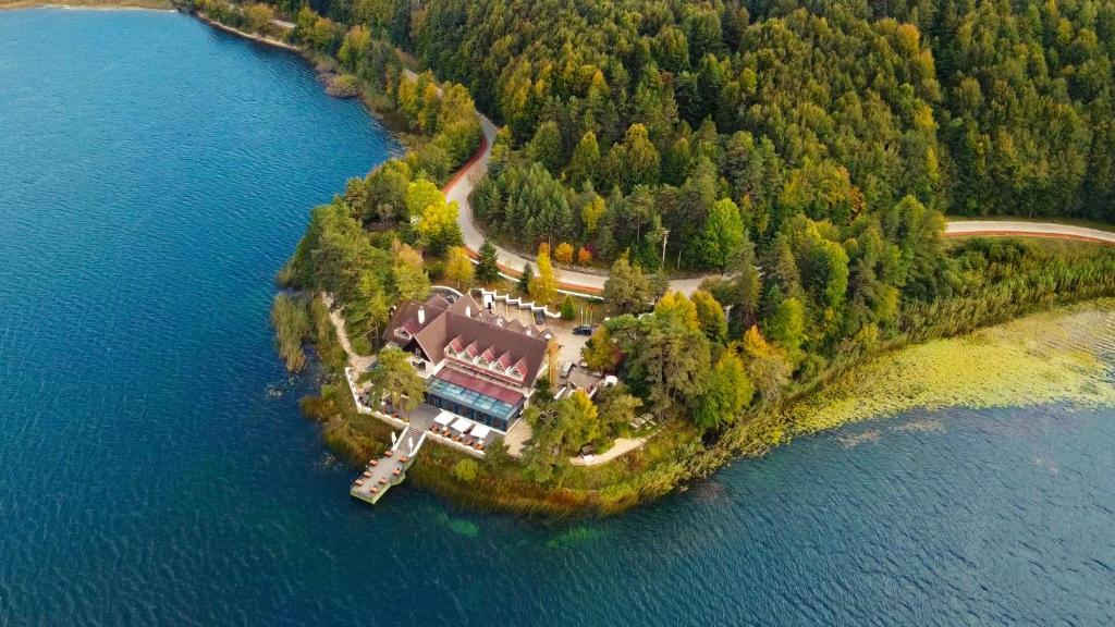 an aerial view of a house on an island in the water at Abant Kosk Oteli in Abant