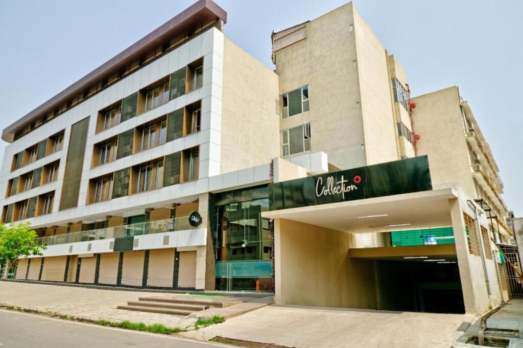 a building with a sign on the front of it at The Park Celebration in Surat