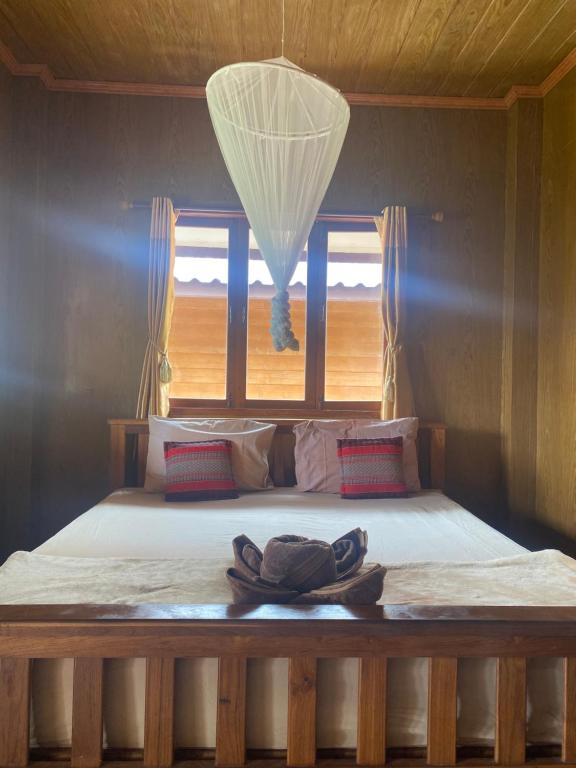Postel nebo postele na pokoji v ubytování Pai Smilehouse