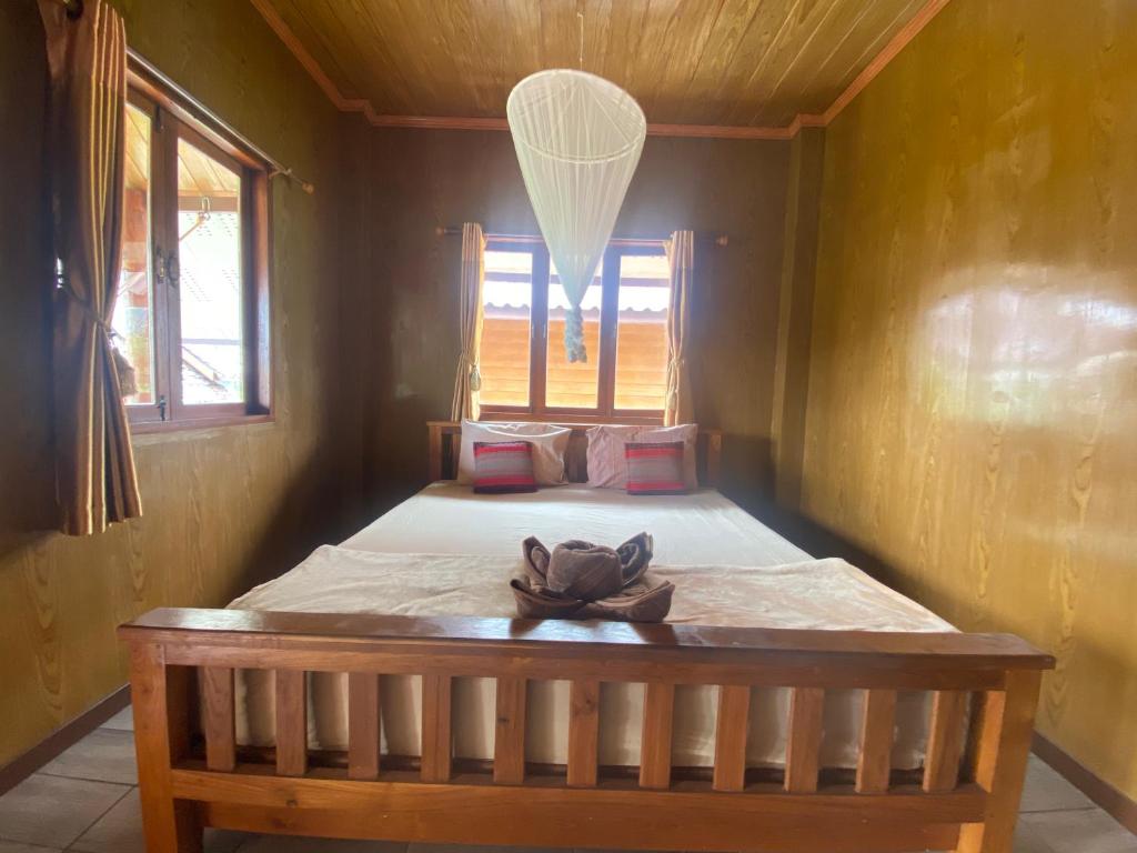 Postel nebo postele na pokoji v ubytování Pai Smilehouse